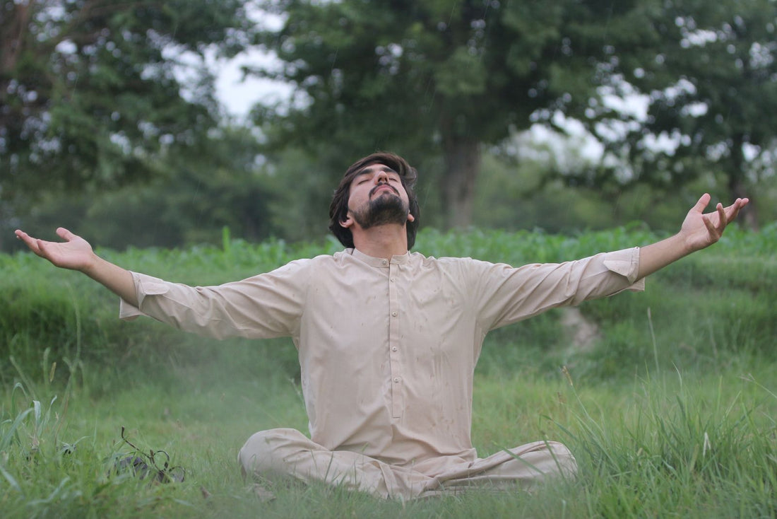 Man practicing mindful breathing outdoors in nature