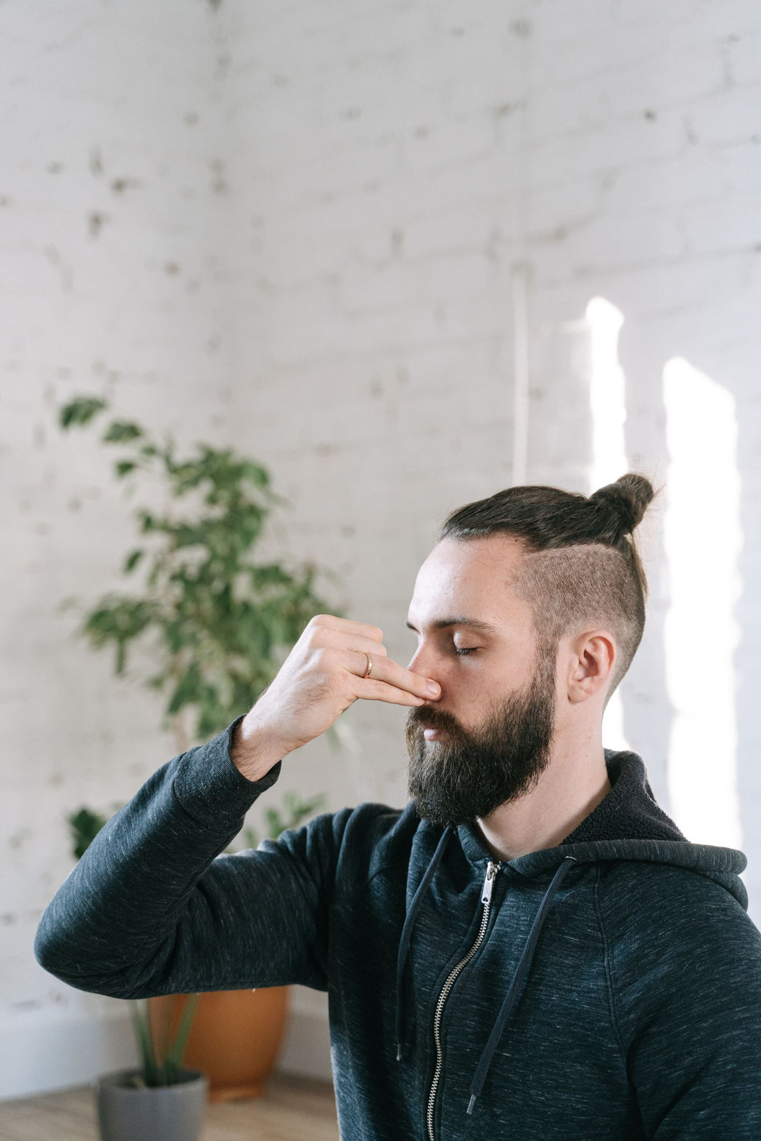 Man practicing controlled breathing during meditation