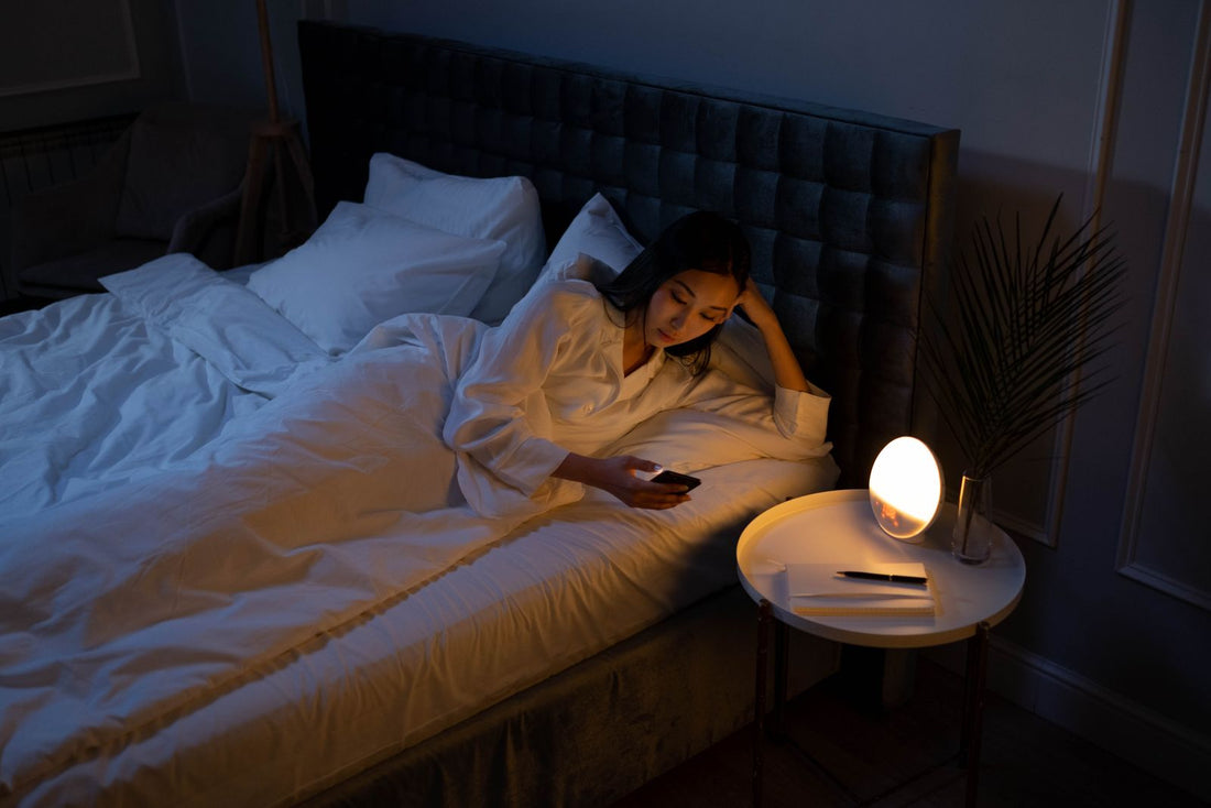 Woman resting on a bed during a night routine