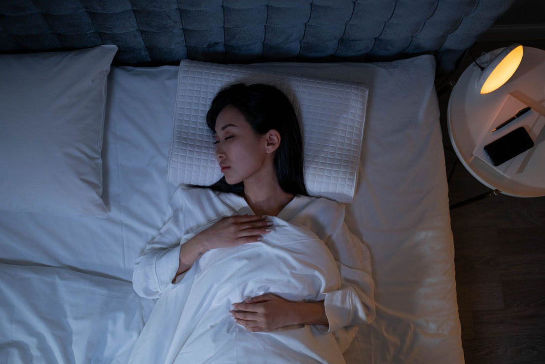 Woman resting peacefully in a bedroom at night