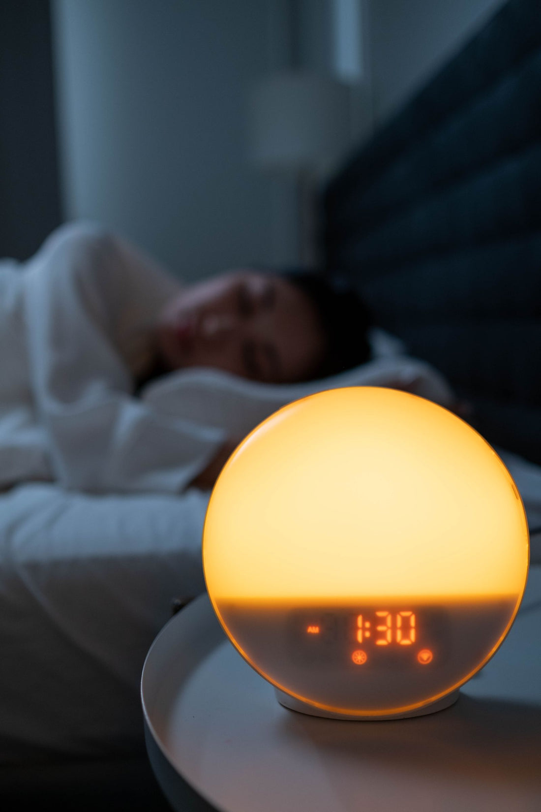 Warm bedroom scene with an alarm clock at night