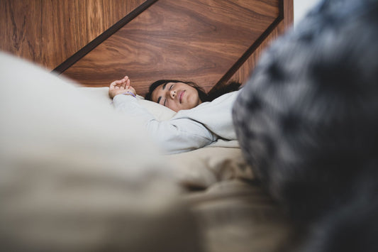 Woman sleeping peacefully during a bedtime breathing routine