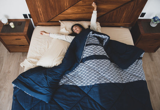 Woman relaxing in bed as part of a night-time routine