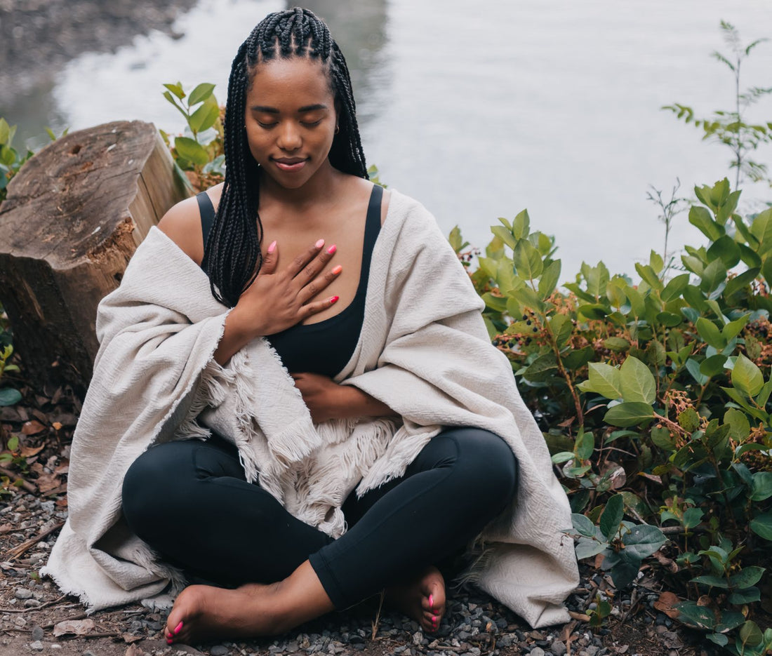 Woman practicing mindful breathing outdoors